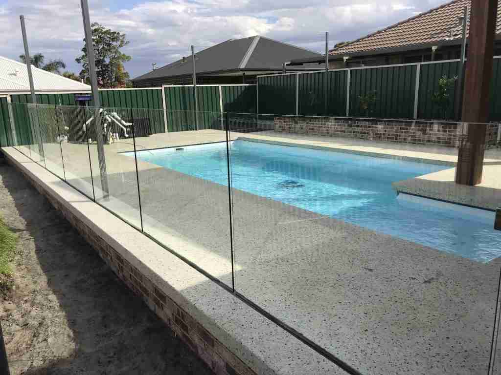 Urban Glass Fencing Fully Frameless Channel Mounted Glass Pool Fence into Poured Aggregate